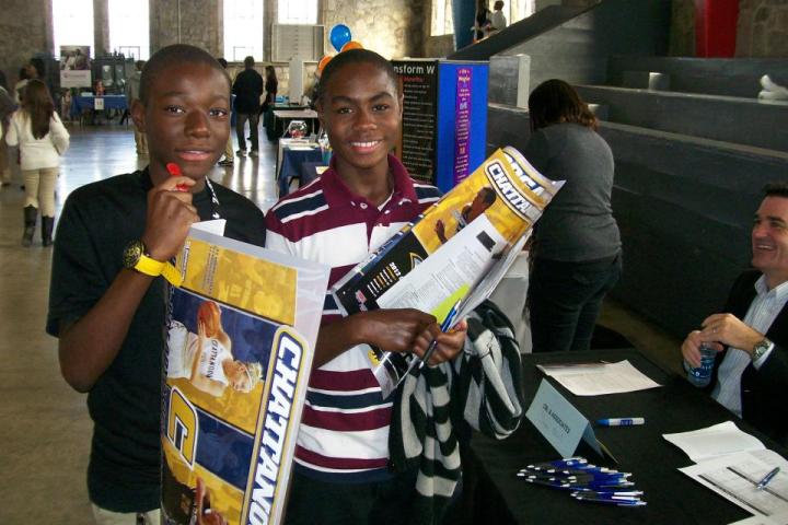Two Students holding UTC gear