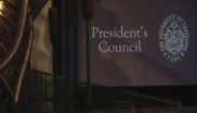 Presentation screen with President's Council logo