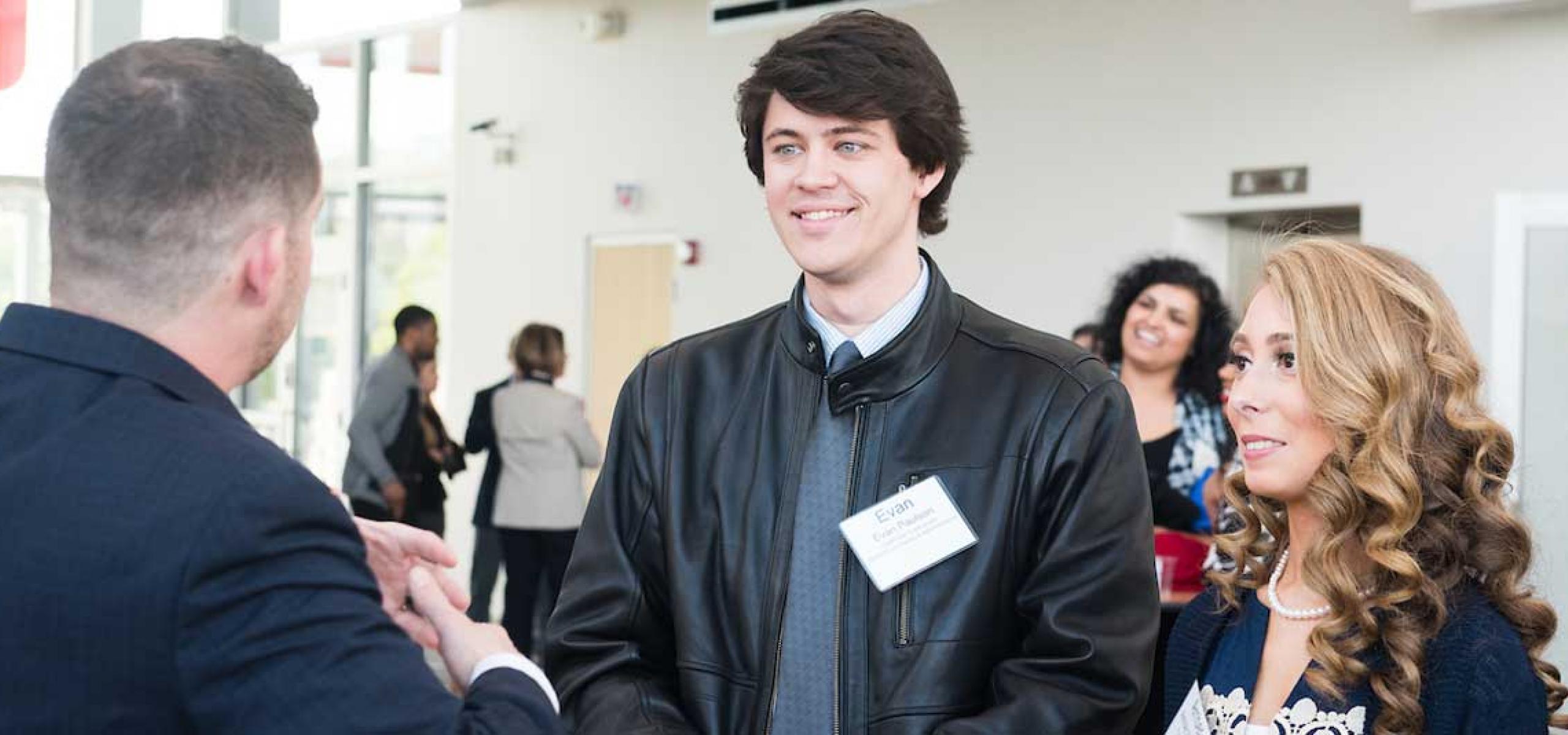 students, alumni and local professionals meet at networking event